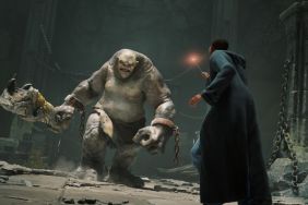 hogwarts legacy screenshot showing wizard facing off against troll