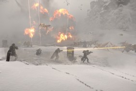 Helldivers 2: soldiers fighting in snow as explosions go off in the background.